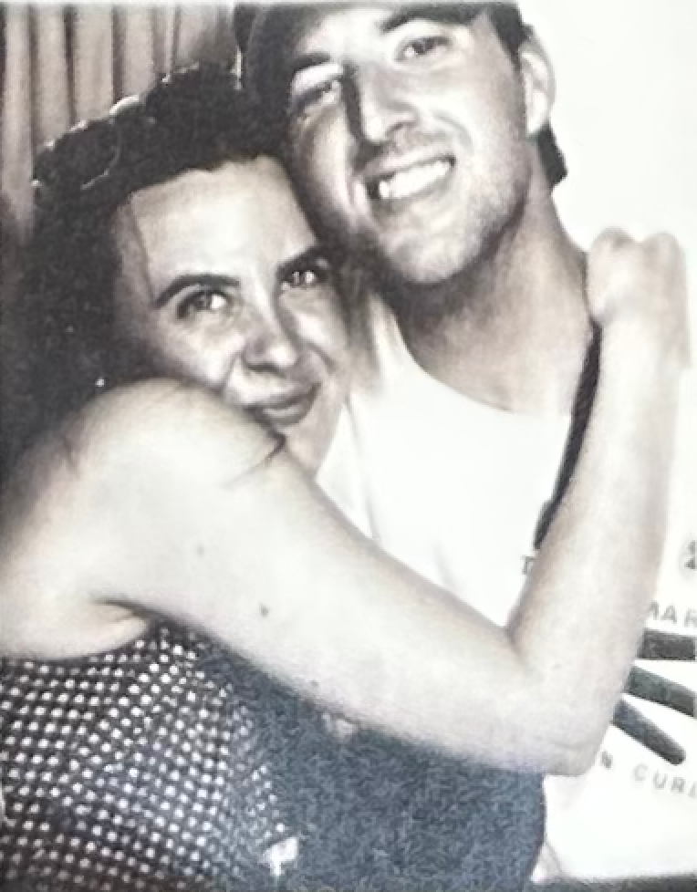 Black and white photo booth strip capturing candid moments.