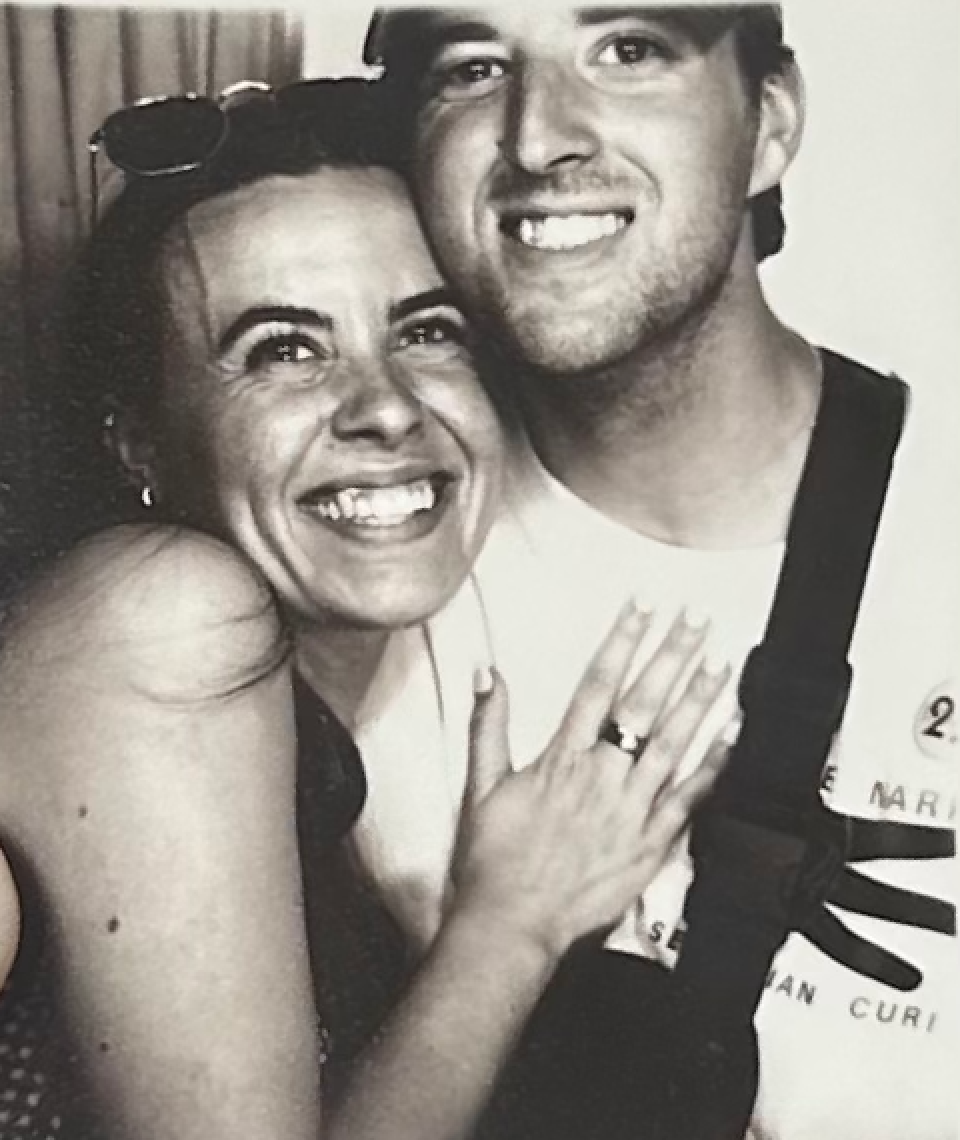 Black and white photo booth sequence showing joyful expressions.
