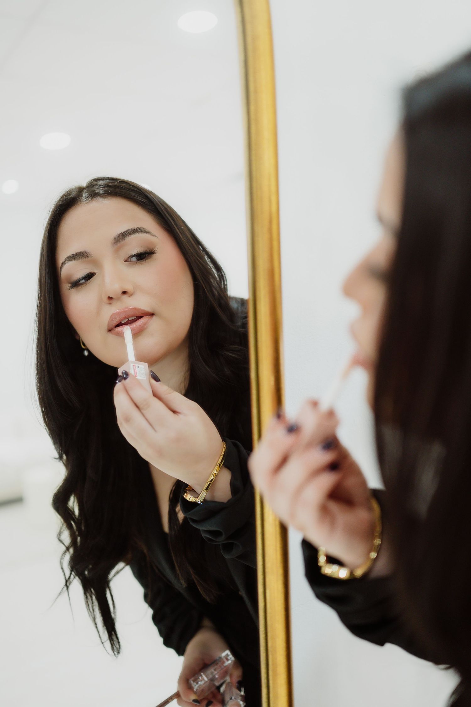 Make up branding photography of make up artist putting lipstick on in the mirror in Jacksonville, Florida