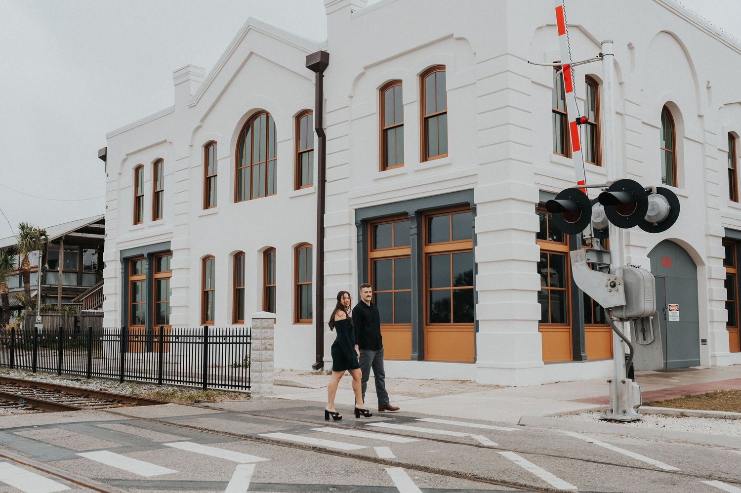 Couple walking hand in hand in downtown Amelia island