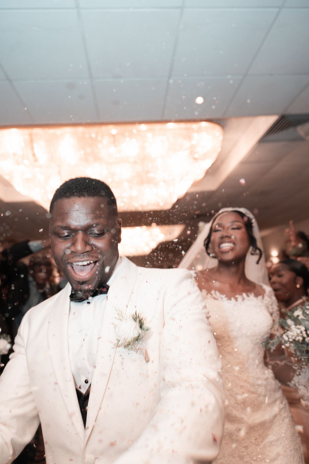 Dami Hassan Luxury wedding photographer - bride and groom confetti
