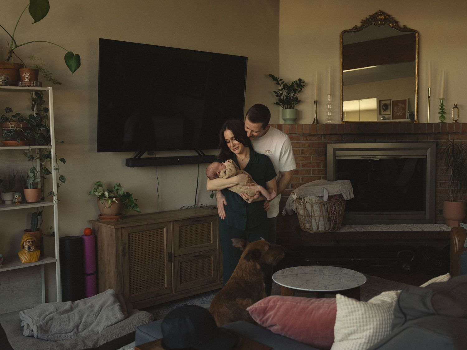 A couple lounges casually on a couch in a cozy living room interior.
