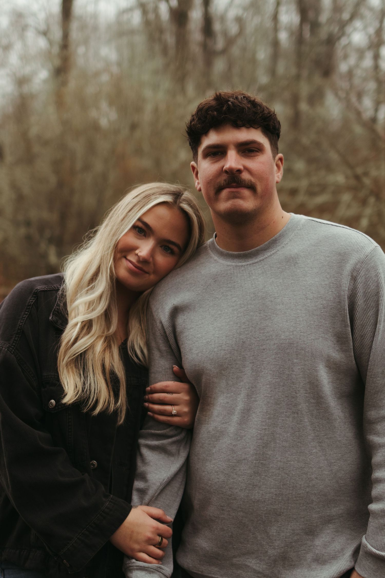 Casual outdoor couple photoshoot with intimate moments and natural expressions.