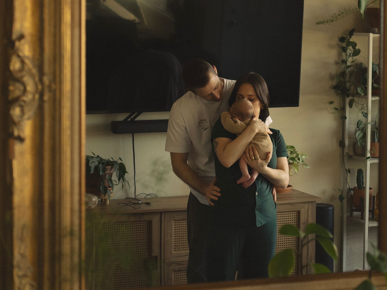 A sequence of intimate indoor photos with warm lighting and mirror reflections.