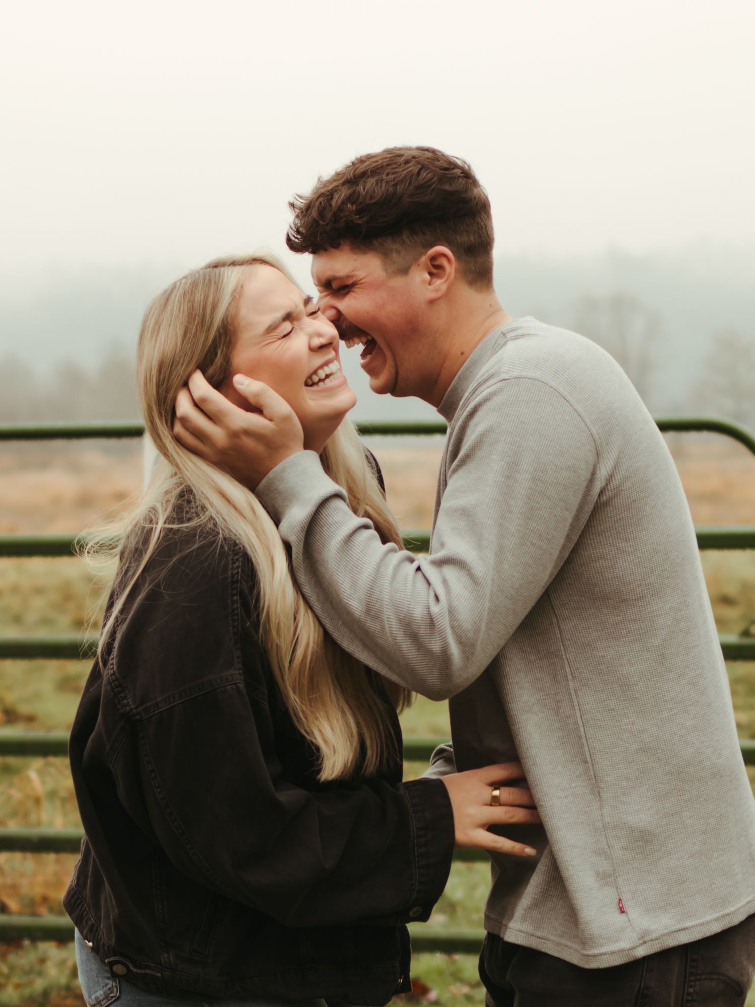 Couple sharing tender moments in an outdoor setting during autumn.