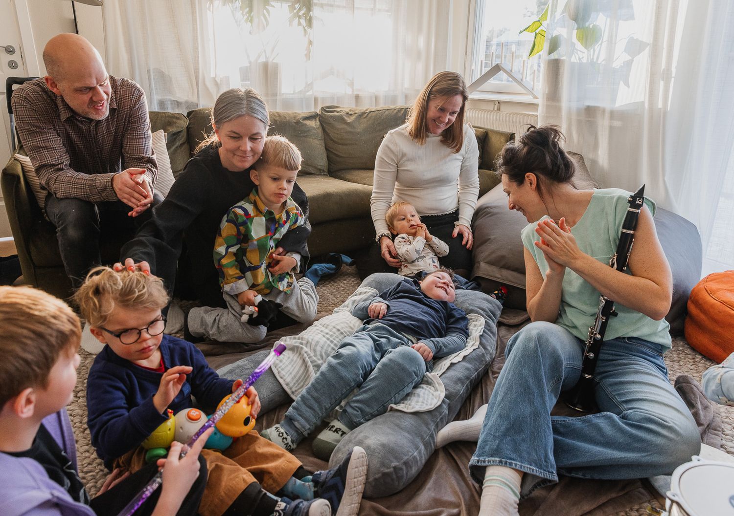 Group relaxing together on couches in a casual home setting.