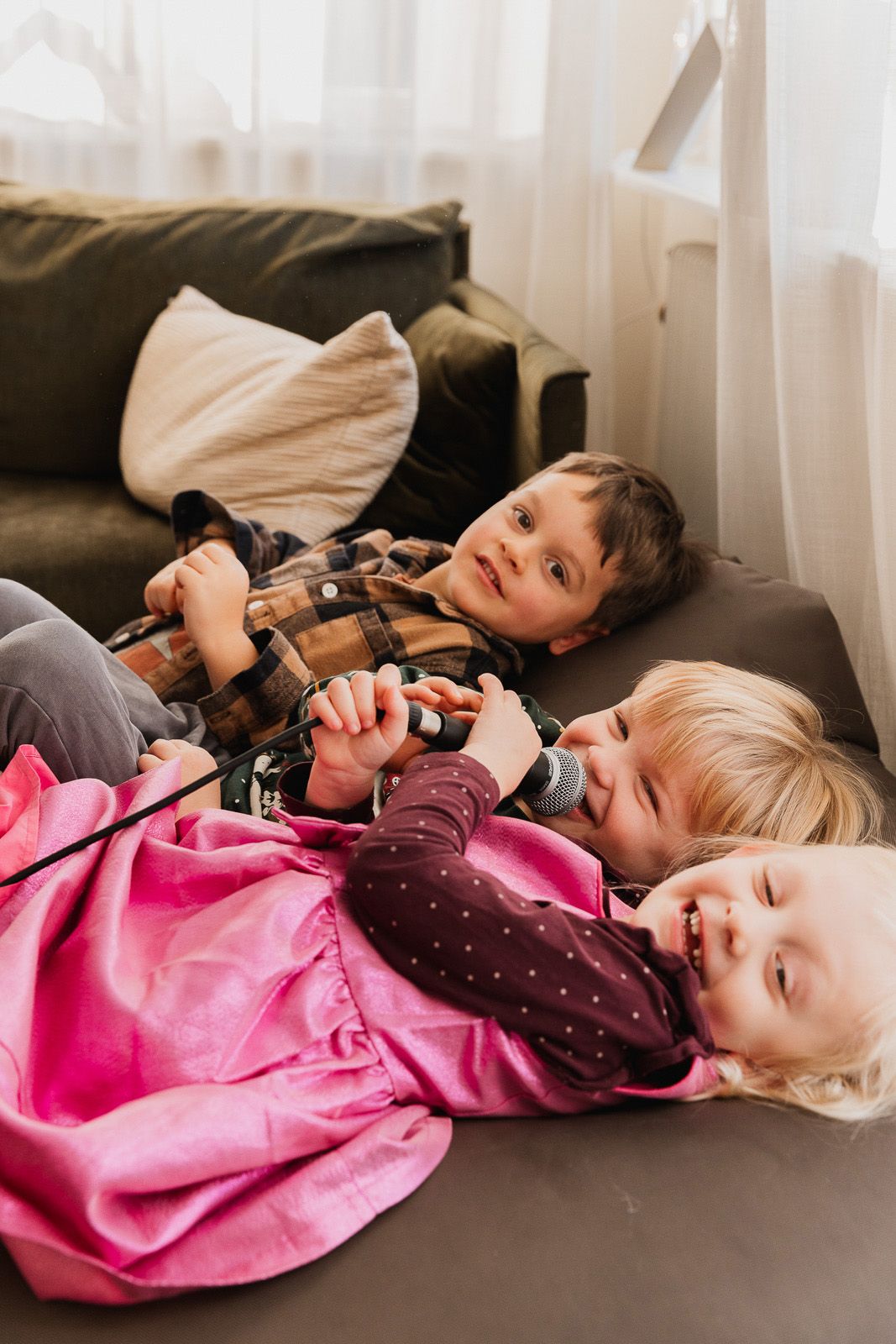 People rest together on comfortable furniture during an indoor activity session.