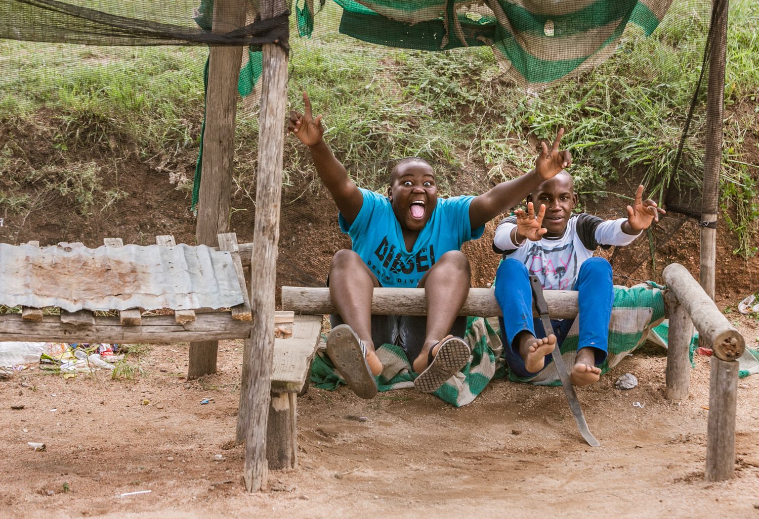 Group relaxing under shaded trees in a casual outdoor gathering.