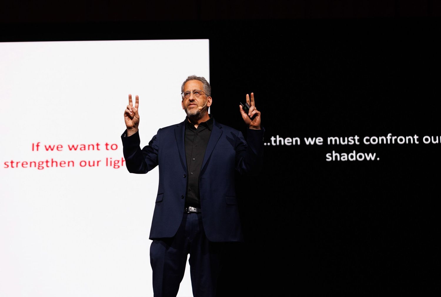 A presentation slide with white text against a dark background showing motivational messaging.