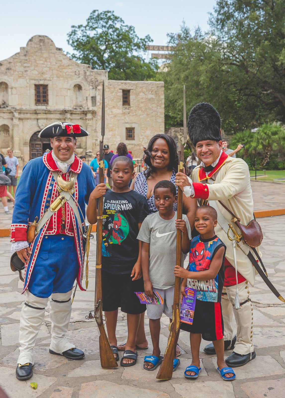 Historical reenactors in period costumes at the Alamo in San Antonio.
