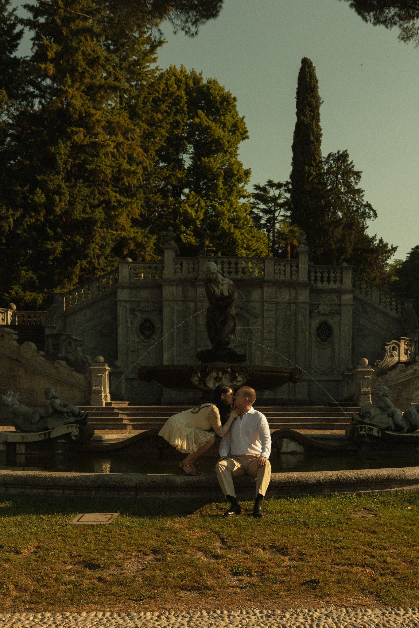 Engagement portrait by the fountain, Parco Civico di Tremezzina, Lake Como, Italy