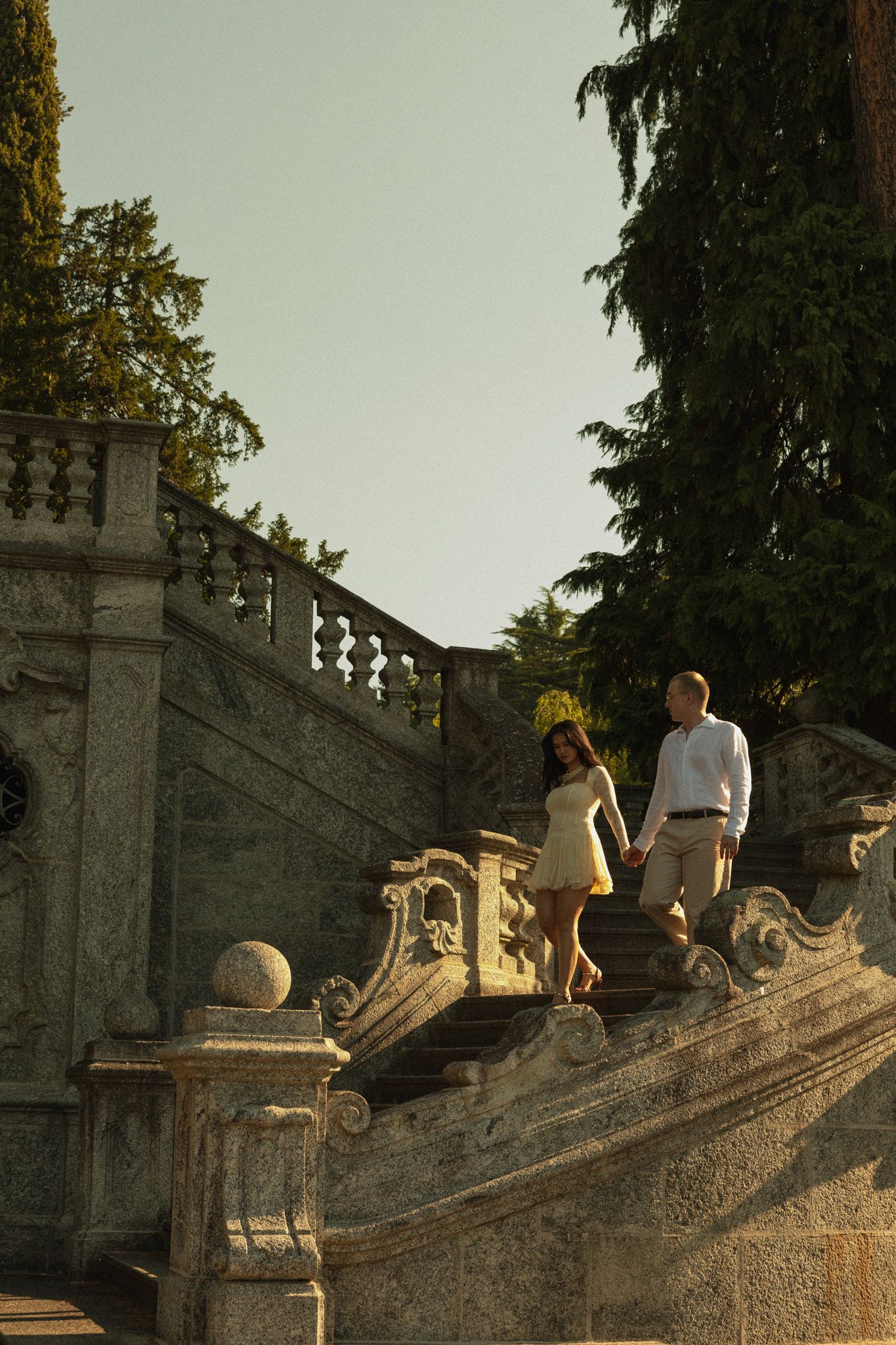 Couple walking down the stone stairs, Tremezzo, Lake Como