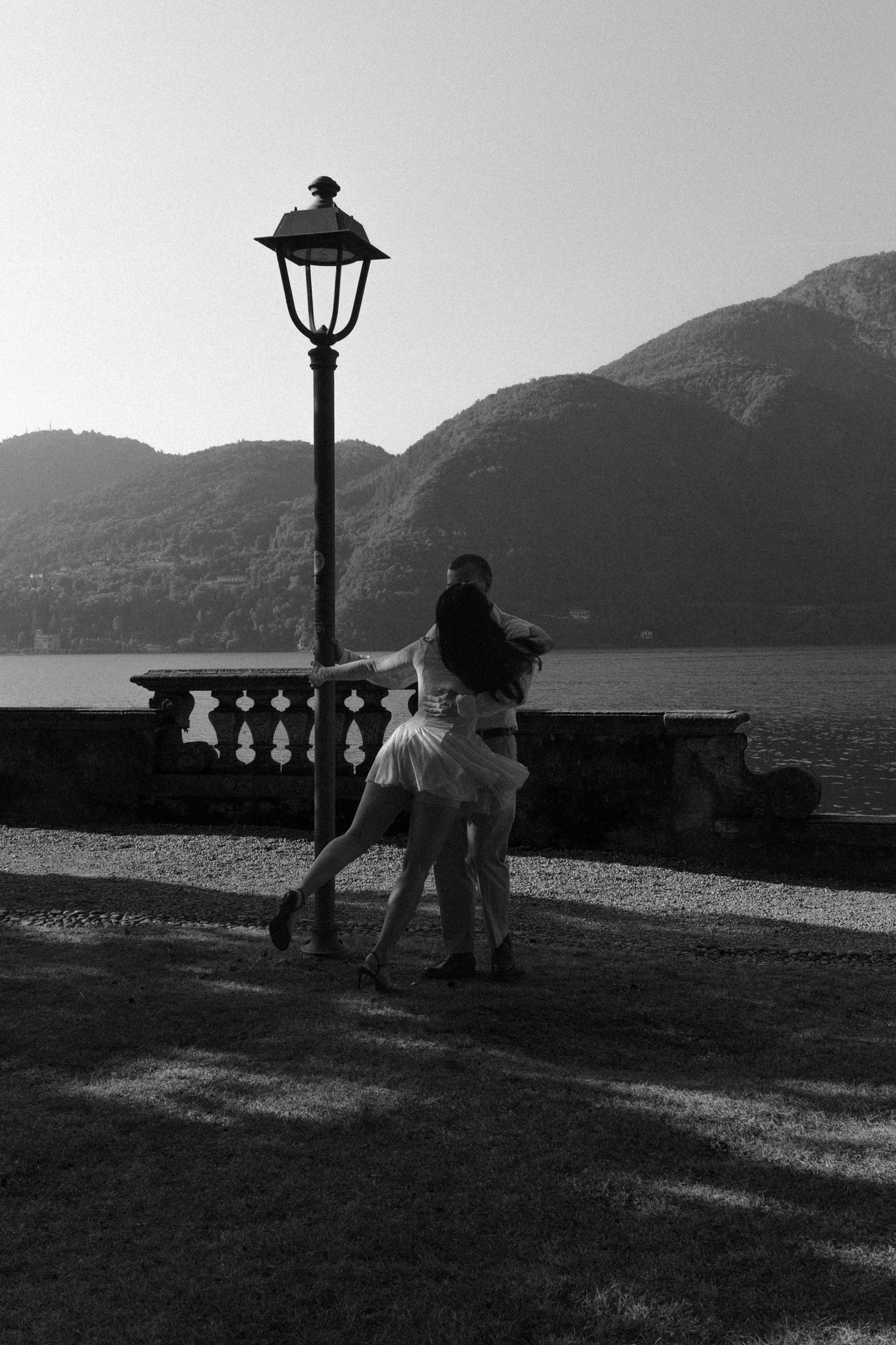 Romantic engagement portrait by the lamppost, Lake Como, Italy