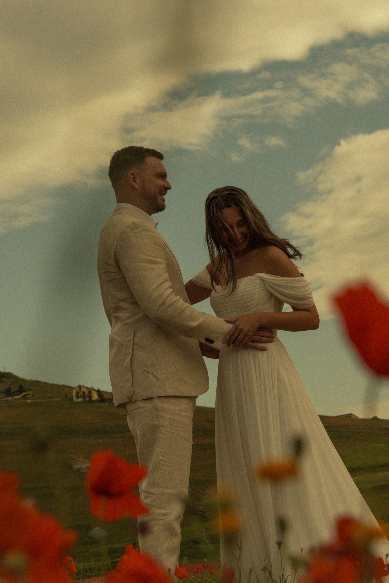 Romantic embrace in the flowering fields of Pian Grande, Umbria