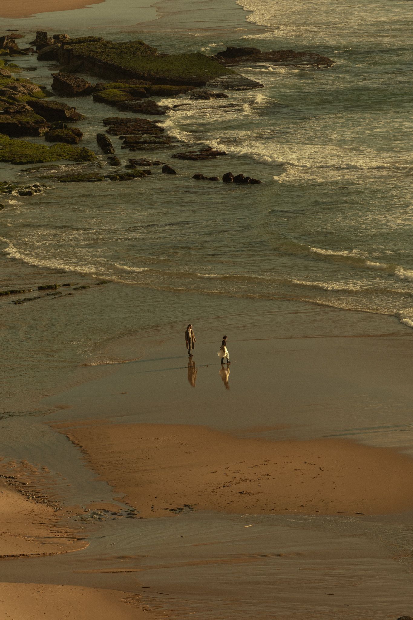 Romantic moment among the coastal rocks, Portugal beach session