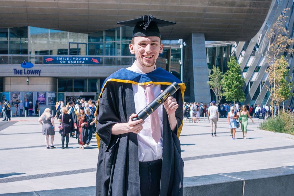 Wedding photographer in graduation gown