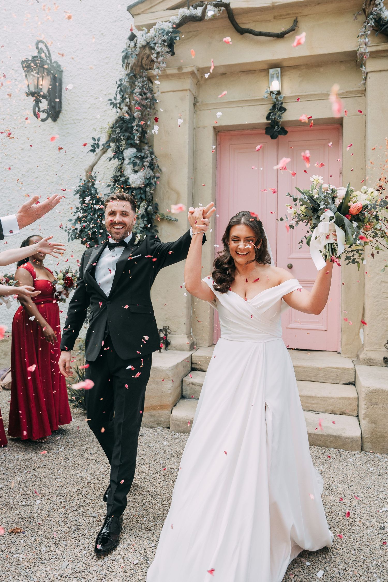 Bride and Groom celebrate with a confetti throw at The Croft Hotel