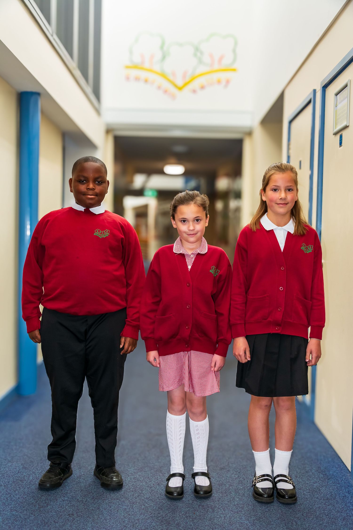 Three primary school children photographed by LJPhotostop for school website content.