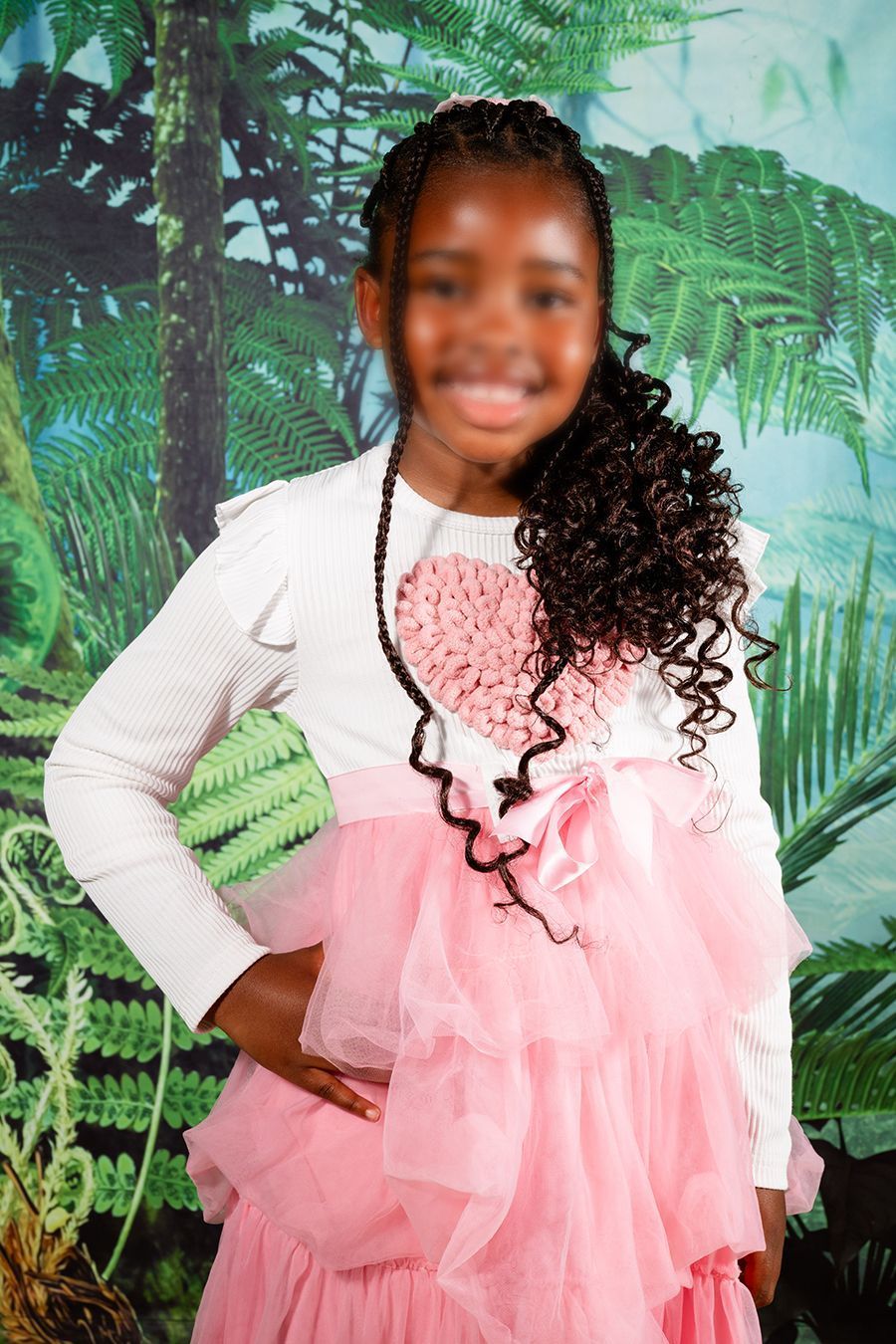 Picture day image of a preschooler, smiling at the camera.