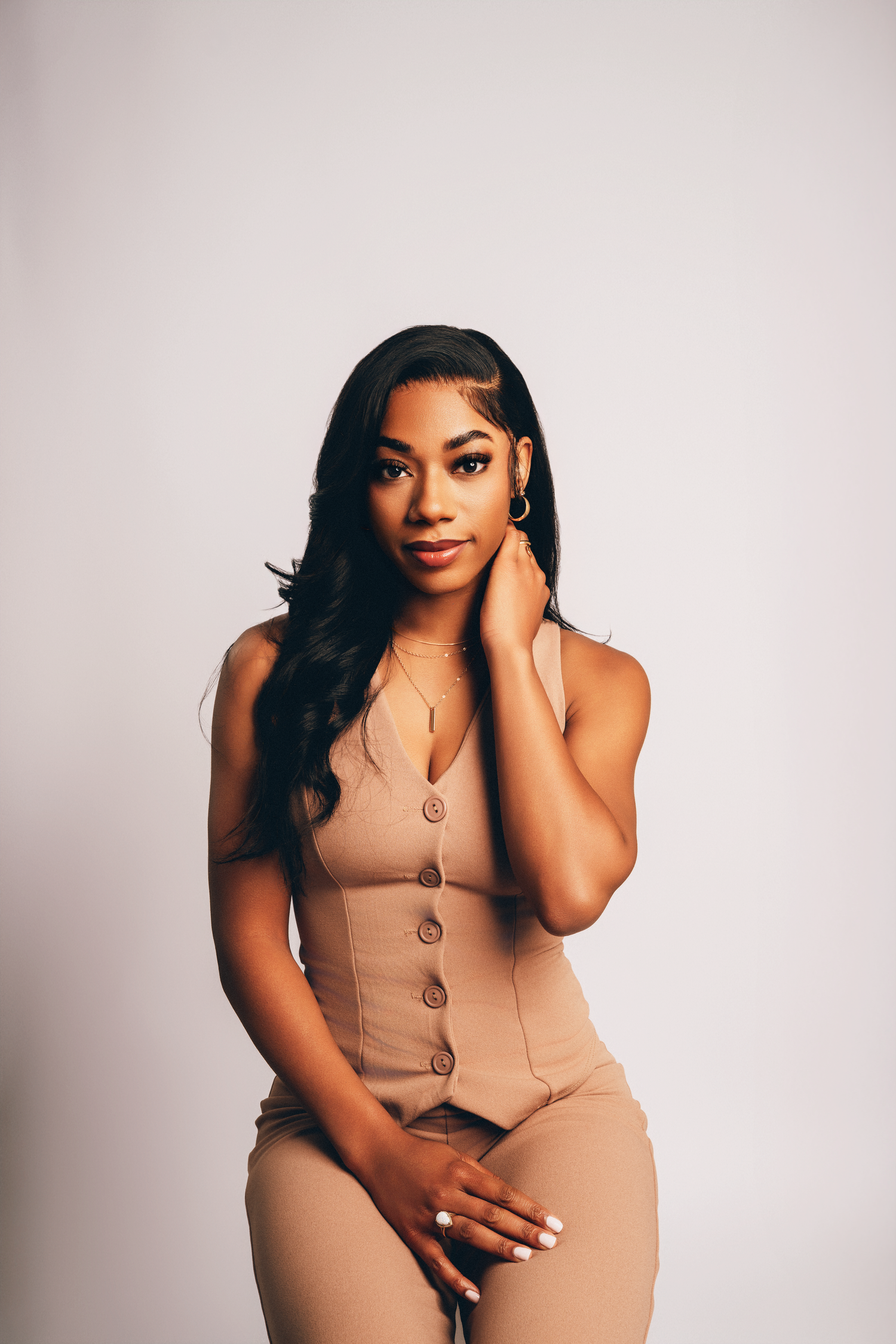 Studio headshot of a woman in neutral-toned outfit with soft lighting, taken by Devonta Battle Photography in Valdosta, GA