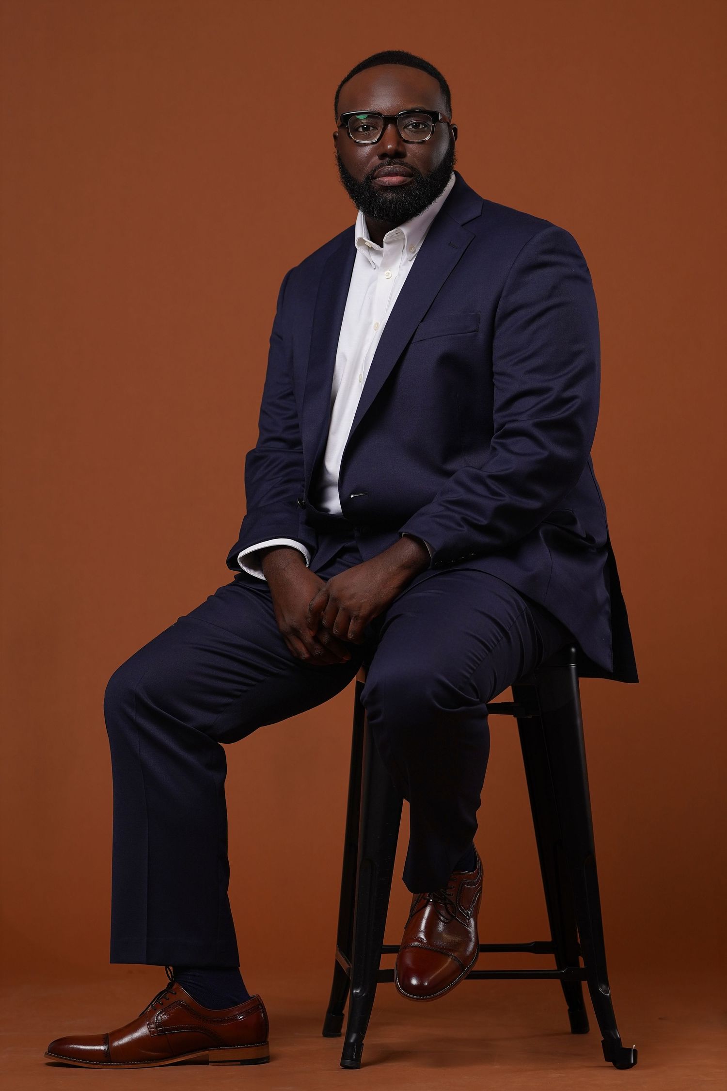 Portrait of Devonta Battle, Valdosta-based photographer, with personal quote about his journey from hobby to capturing real moments through