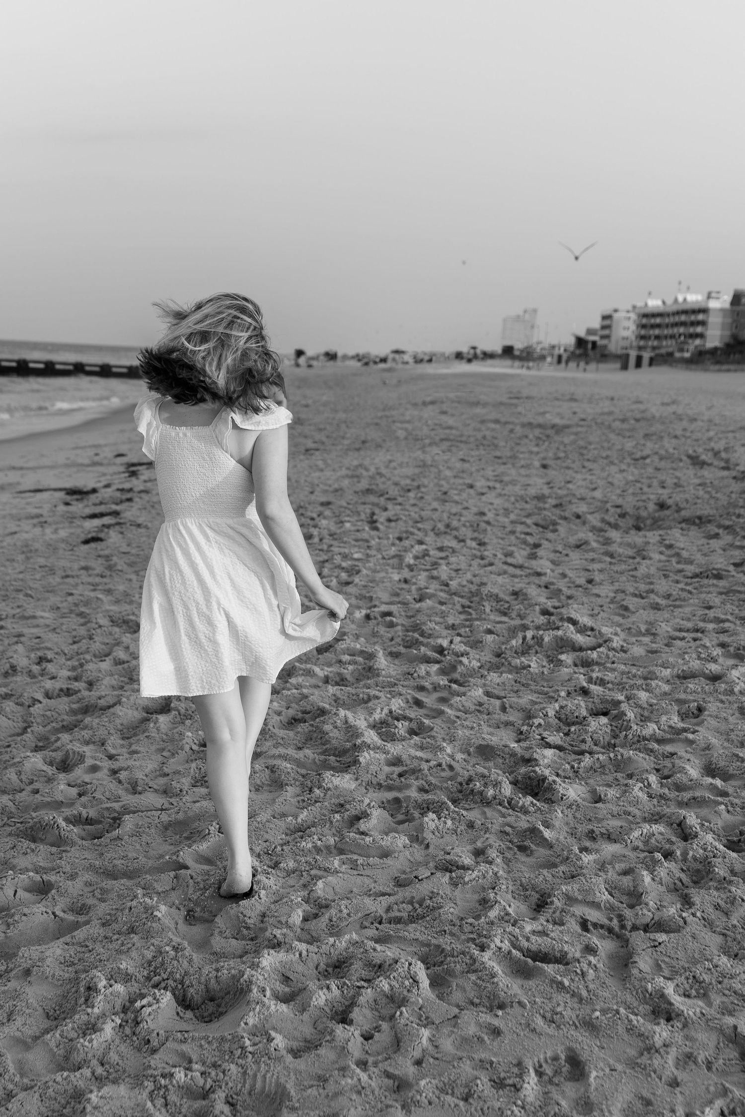 Black and white portrait of a couple together on the beach during a romantic couples photography session