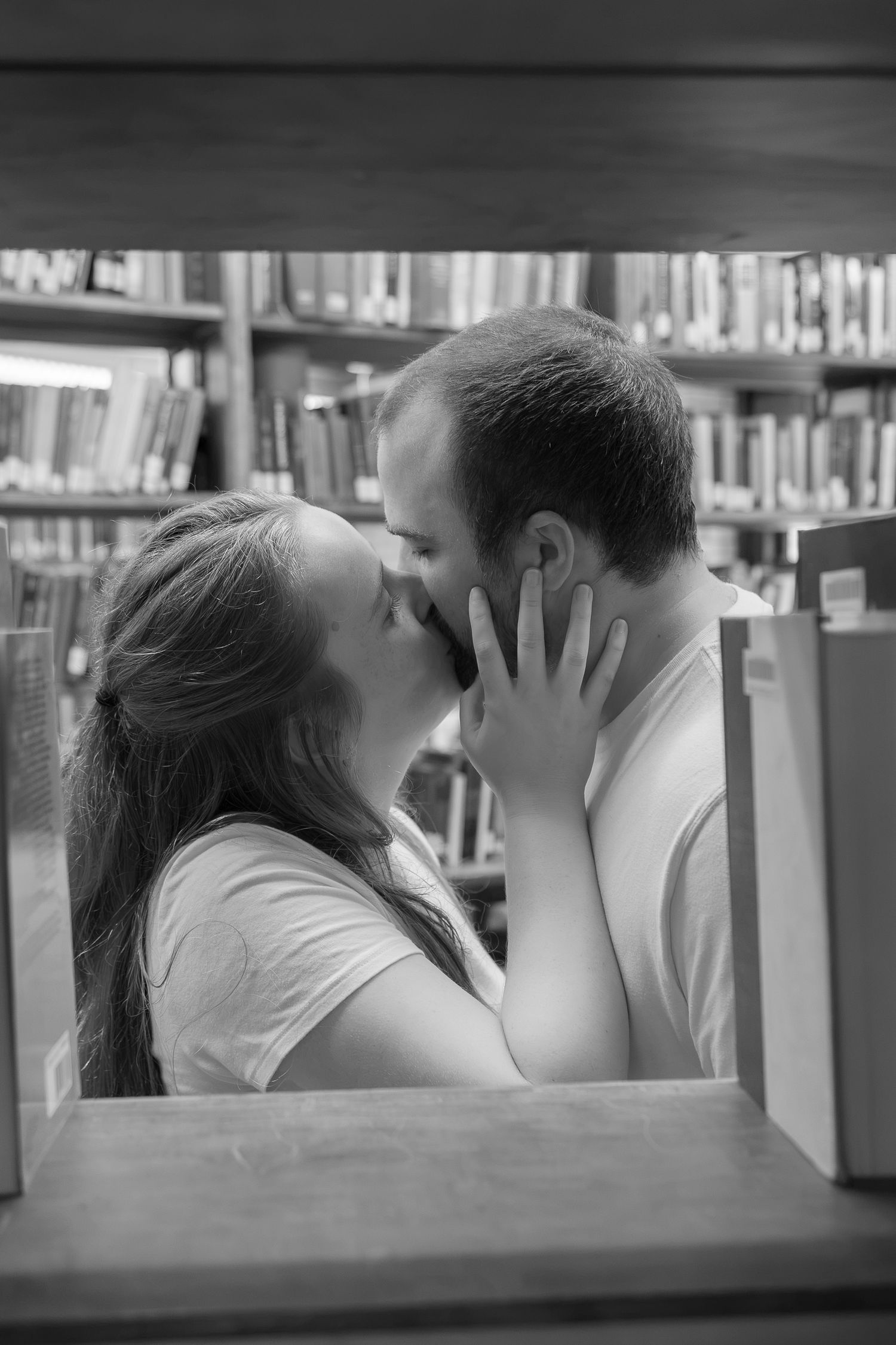 Couple kissing inside Linderman Library at Lehigh University in Bethlehem, Pennsylvania during a couples photography session