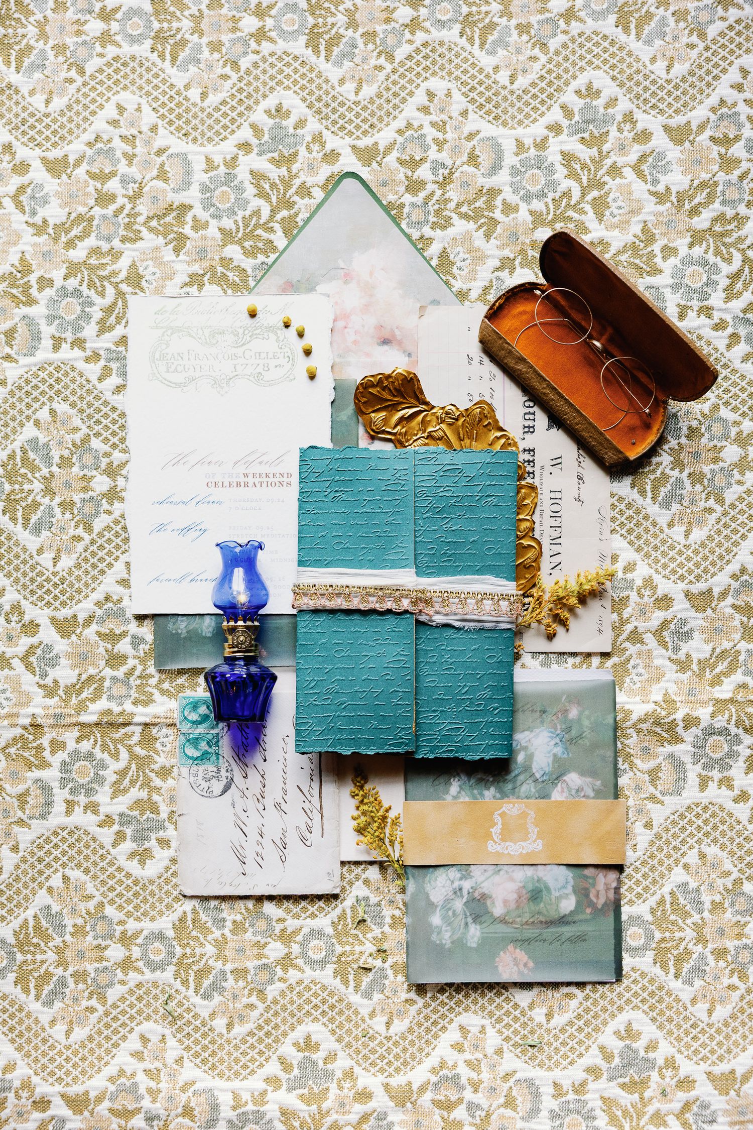 Editorial flat lay of wedding invitations, ribbon and detail pieces photographed at Elkins Estate in Elkins Park, Pennsylvania.