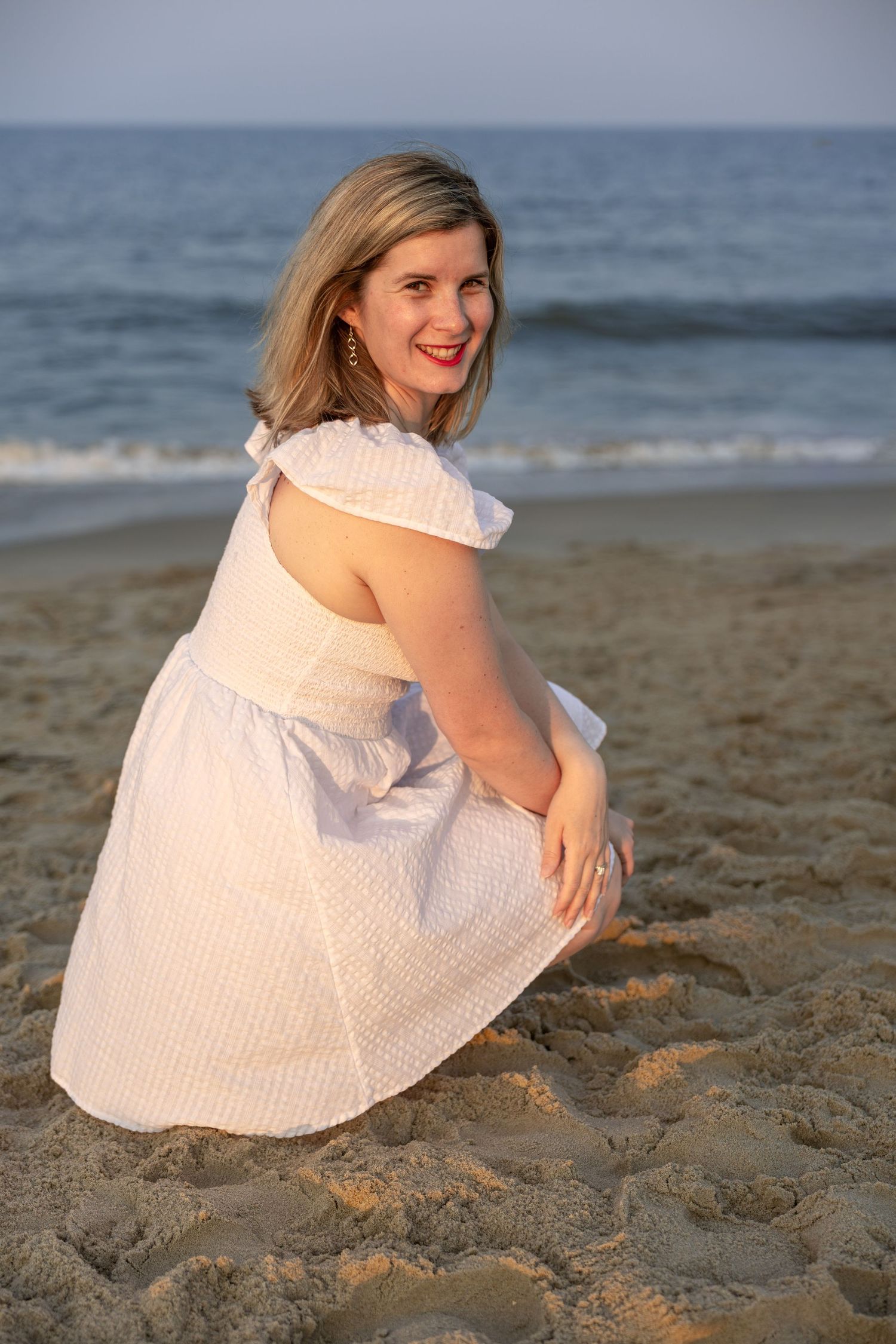 Women posing on the beach during a portrait session in Rehoboth Beach, Delaware.