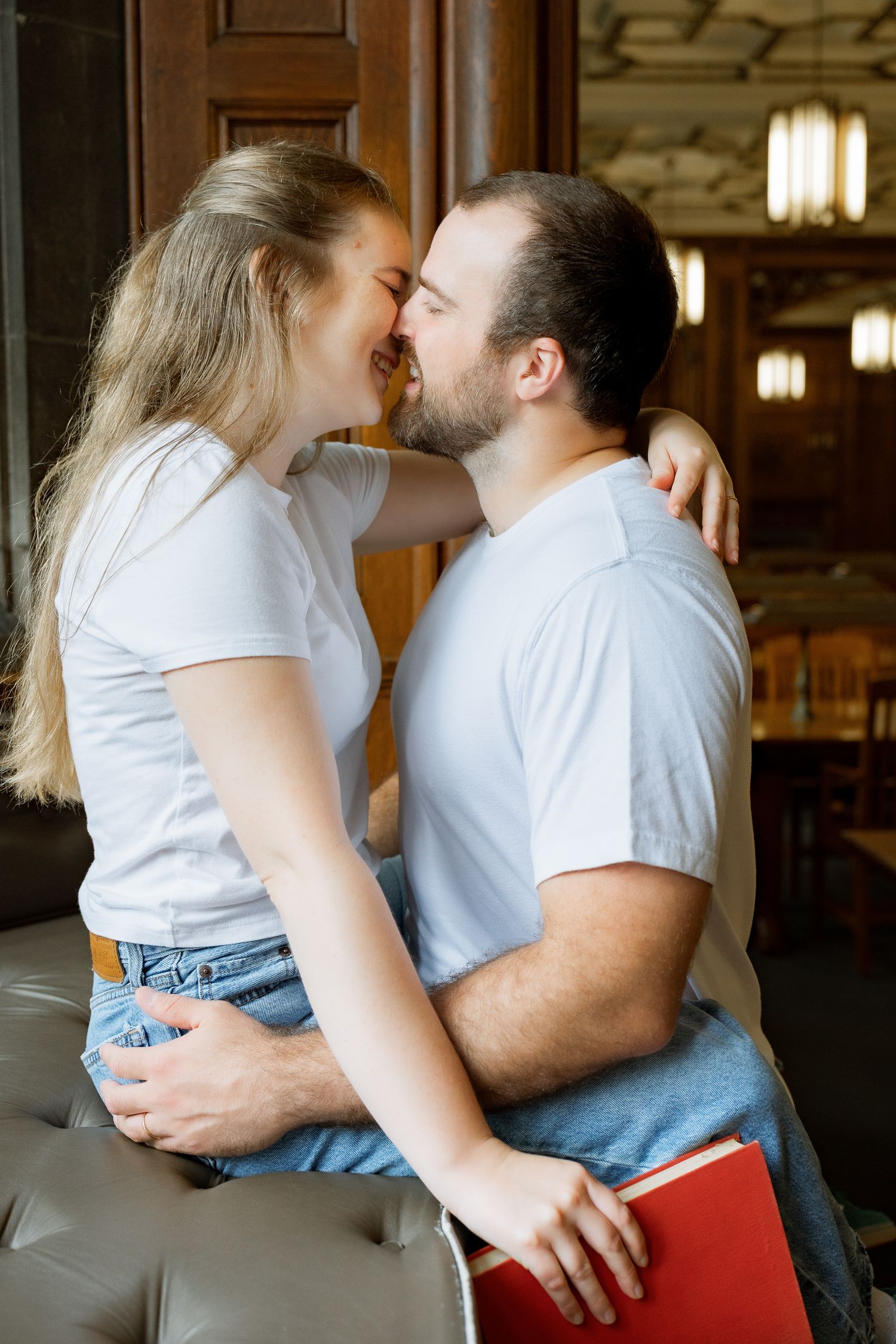 Couple kissing inside Linderman Library at Lehigh University in Bethlehem, Pennsylvania during a couples photography session