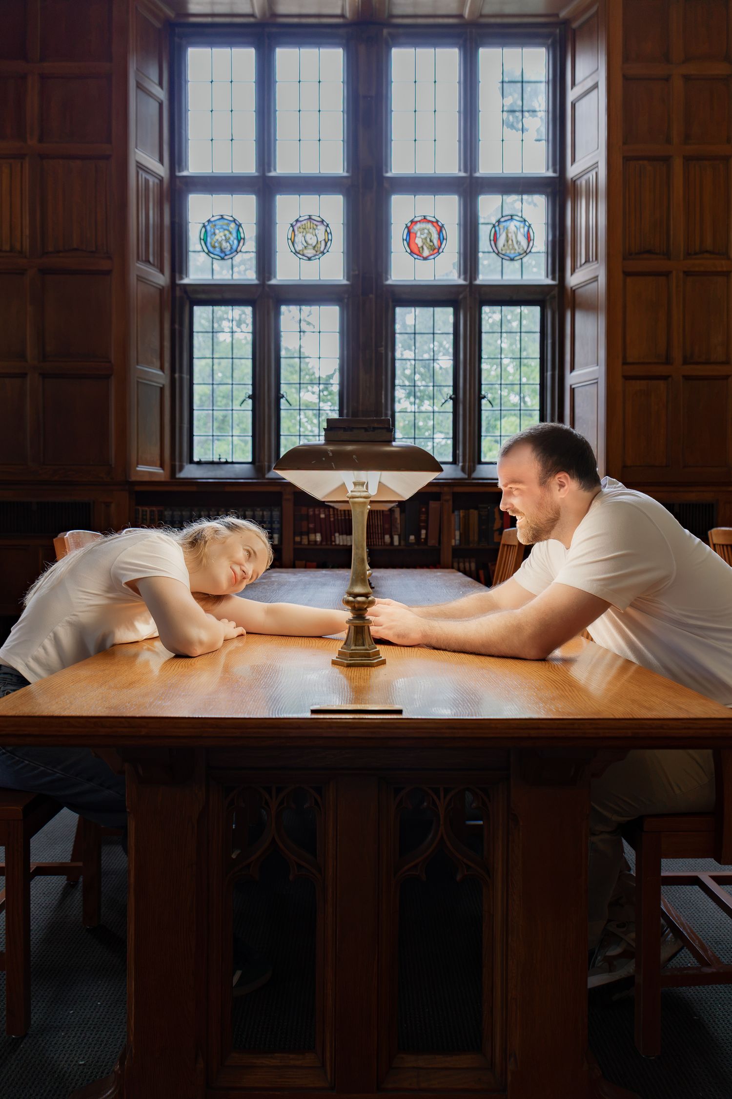 Couple sharing an intimate moment across a table during an indoor Pennsylvania couples photography session.