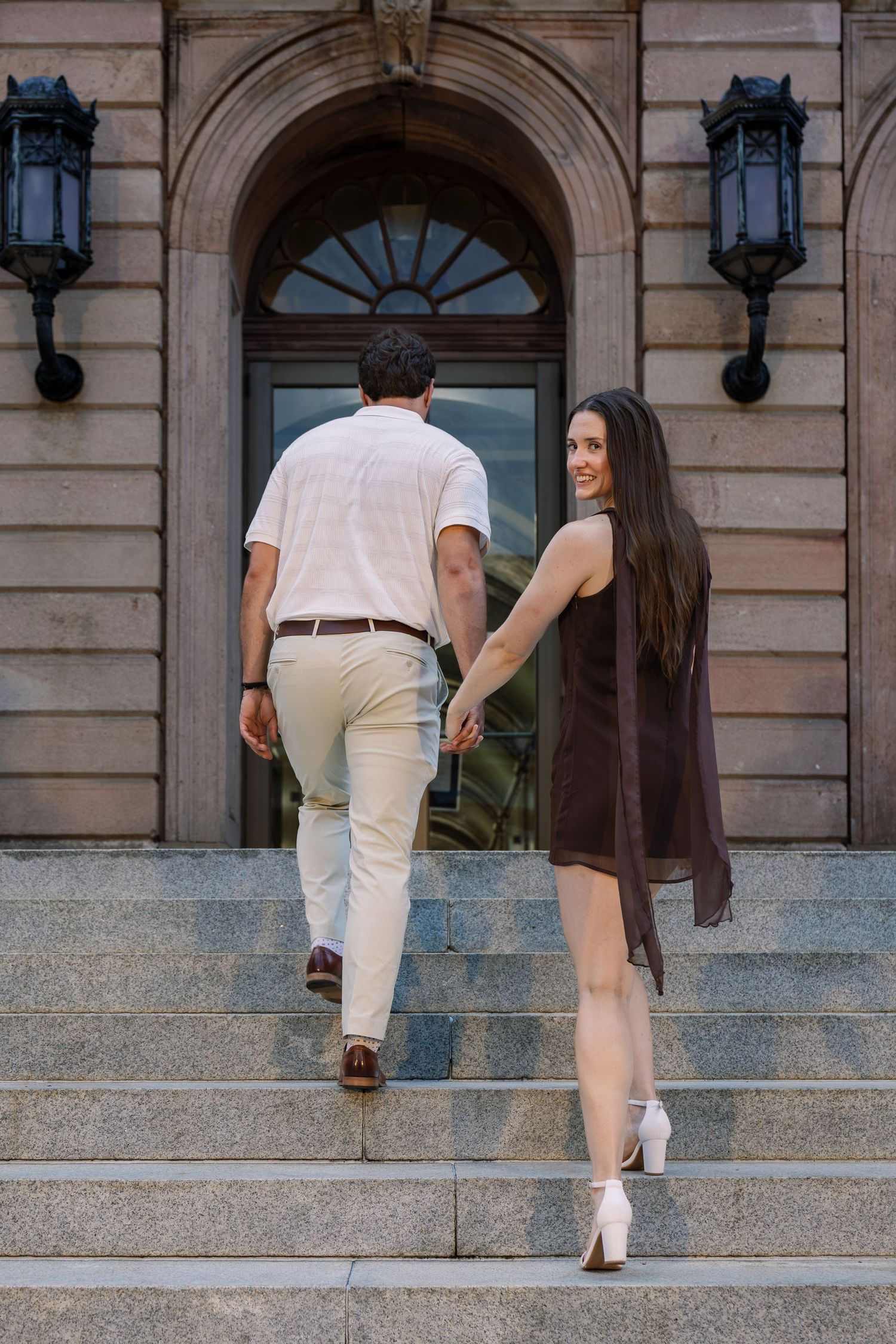 Couple walking hand in hand through downtown Lancaster during a Pennsylvania couples photography session