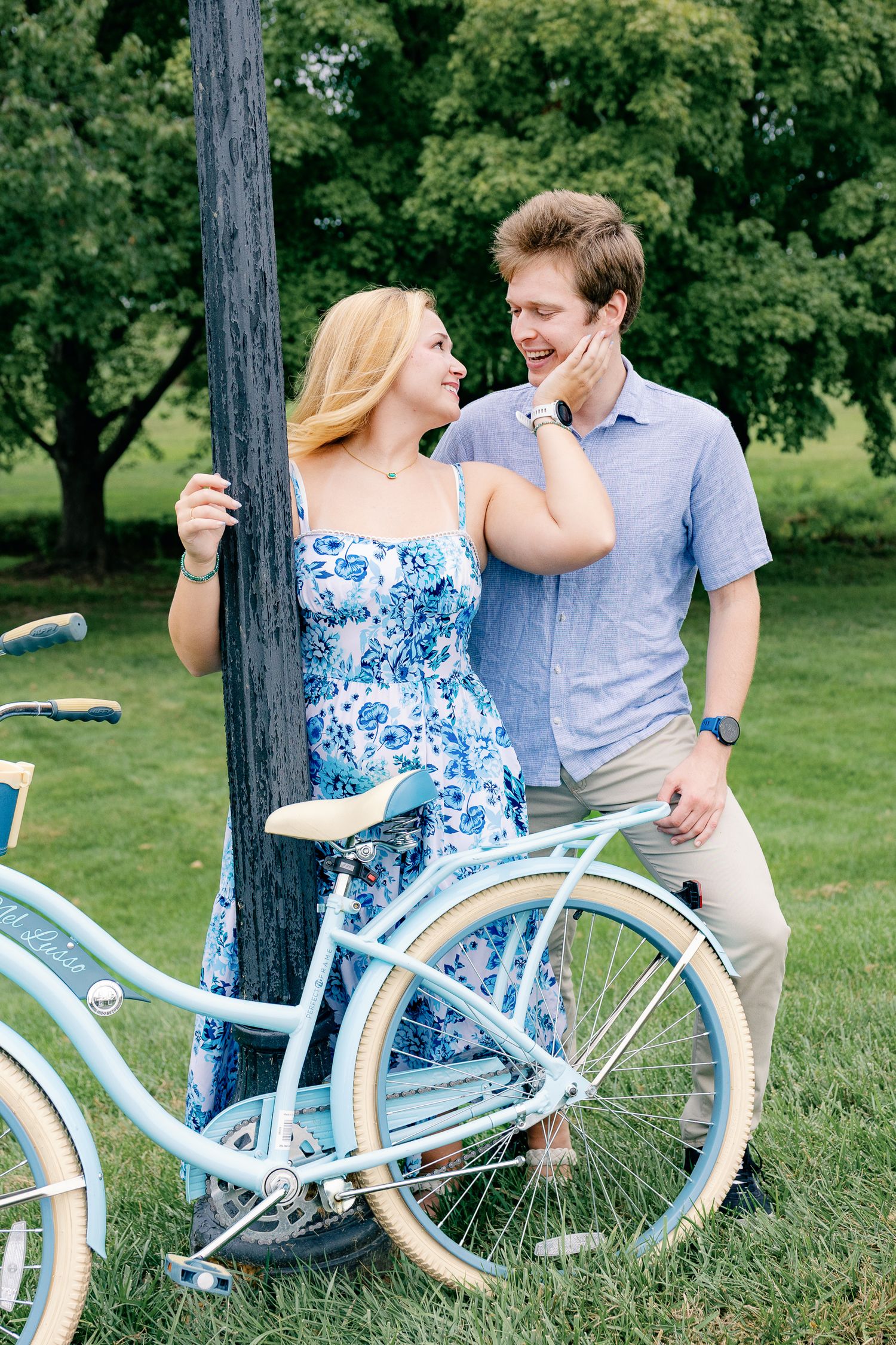 Couple posing beside a vintage bicycle during an outdoor couples photography session in Lancaster, Pennsylvania