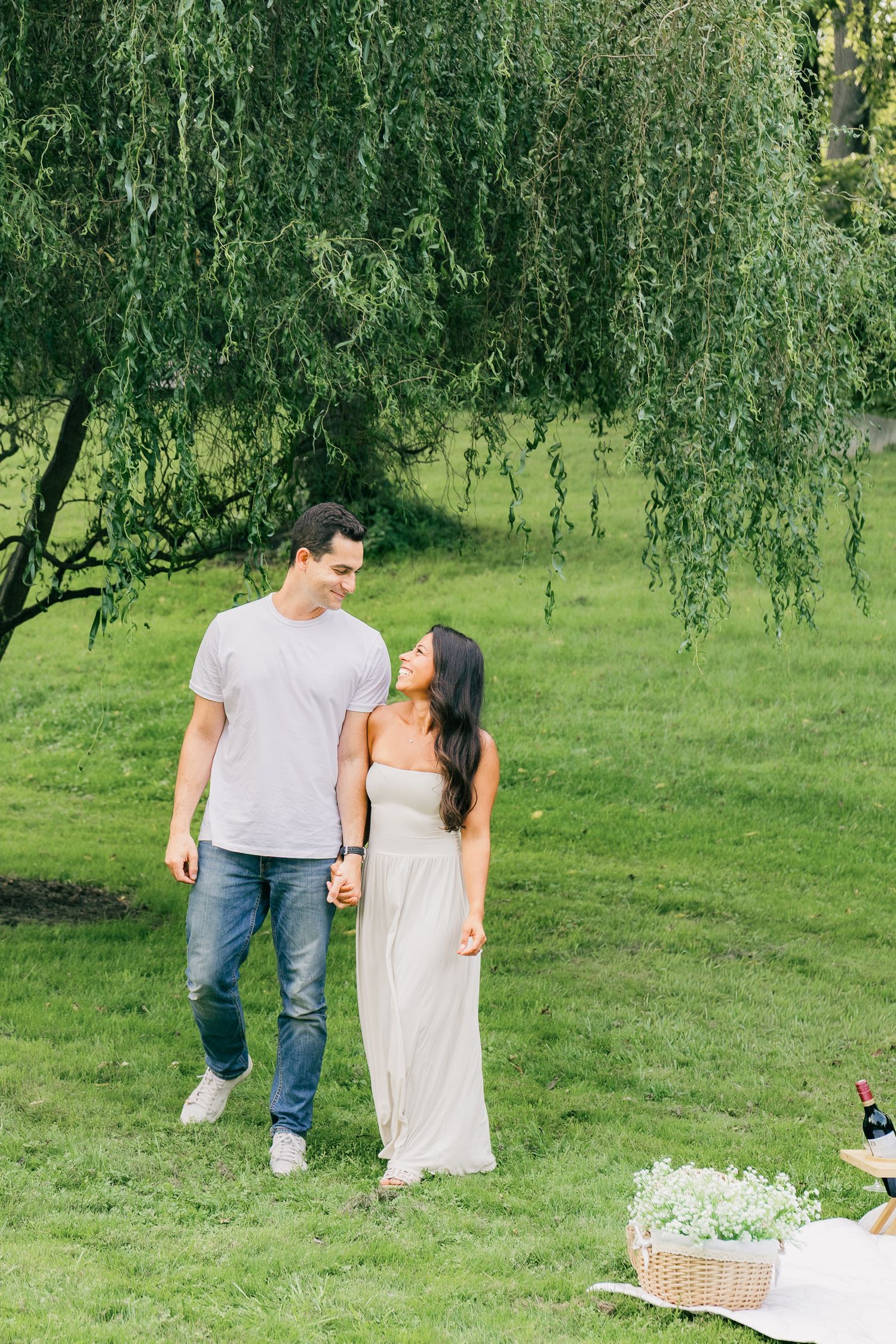 Couple walking hand in hand during a picnic couple photography session at Reading Public Museum in Reading, Pennsylvania