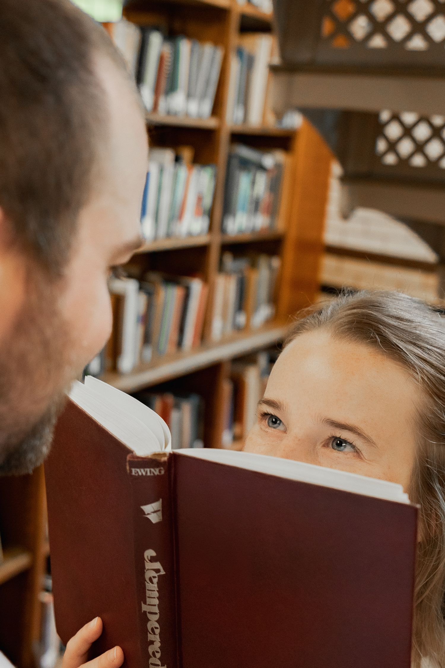 Couple sharing a quiet moment together in the Linderman Library in Bethlehem, Pennsylvania during a photography session