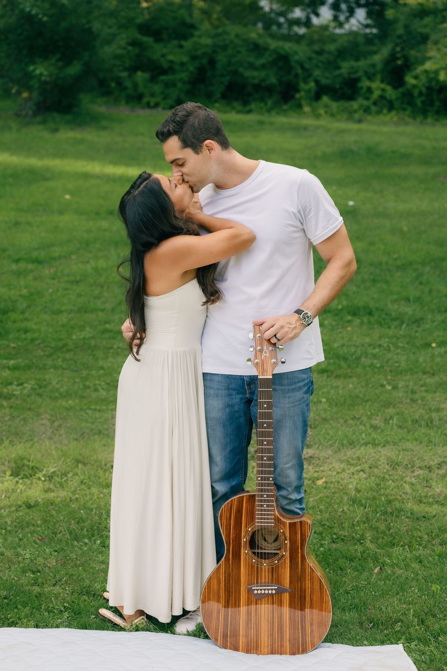 Couple together with a guitar during a romantic outdoor couples photography session in Pennsylvania