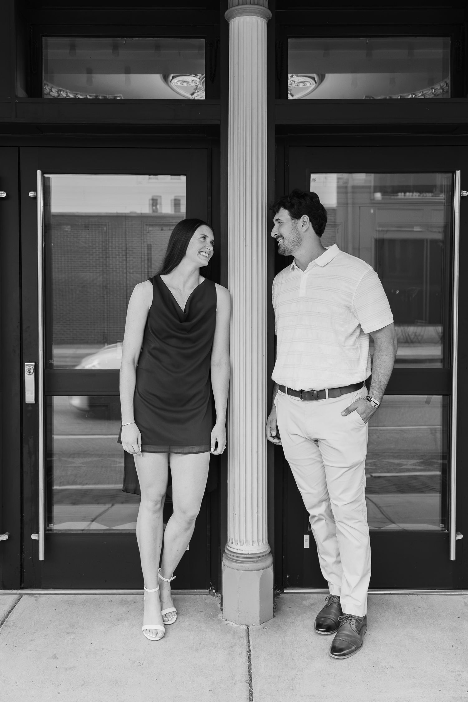 Engaged couple laughing together outside during a downtown Lancaster, Pennsylvania engagement session.