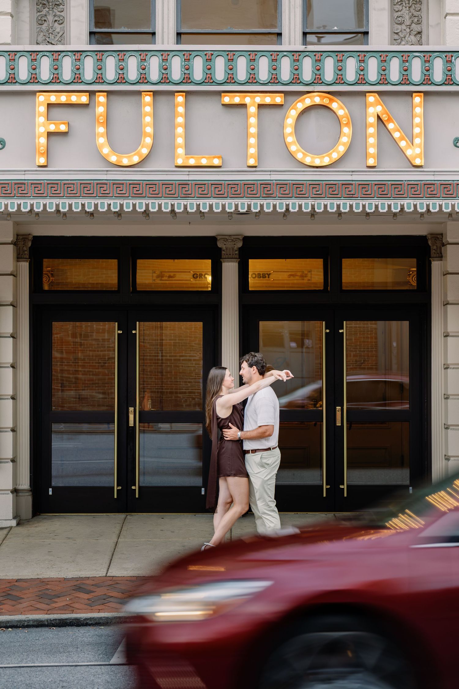 Couple outside the Fulton Theatre during a romantic downtown Lancaster PA couples photography session