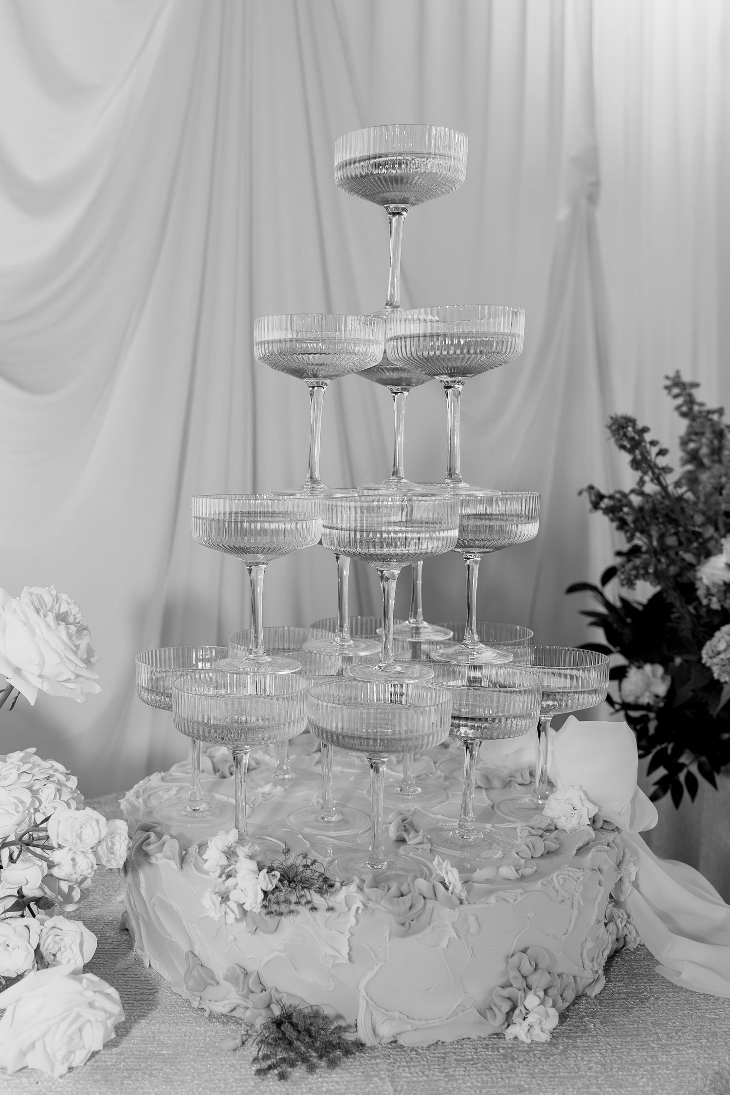 Champagne tower wedding detail with elegant white styling at Elkins Estate, a historic Pennsylvania wedding venue.
