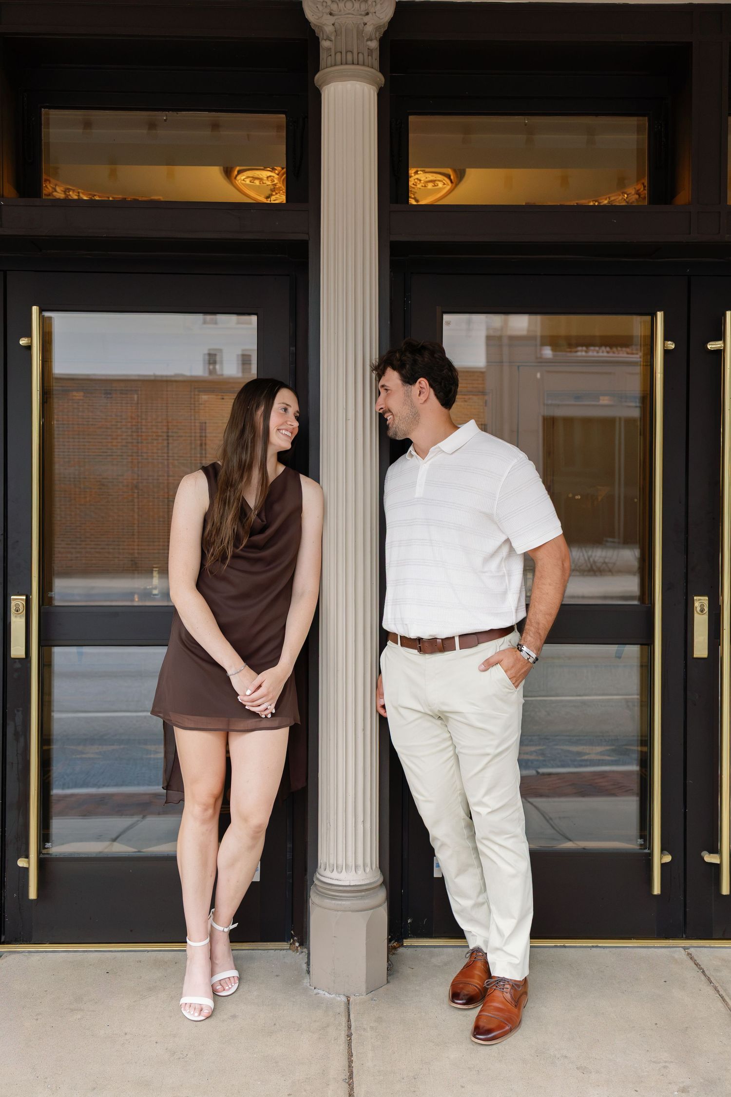 Couple posing outside a historic building during a downtown Lancaster PA couples photography session
