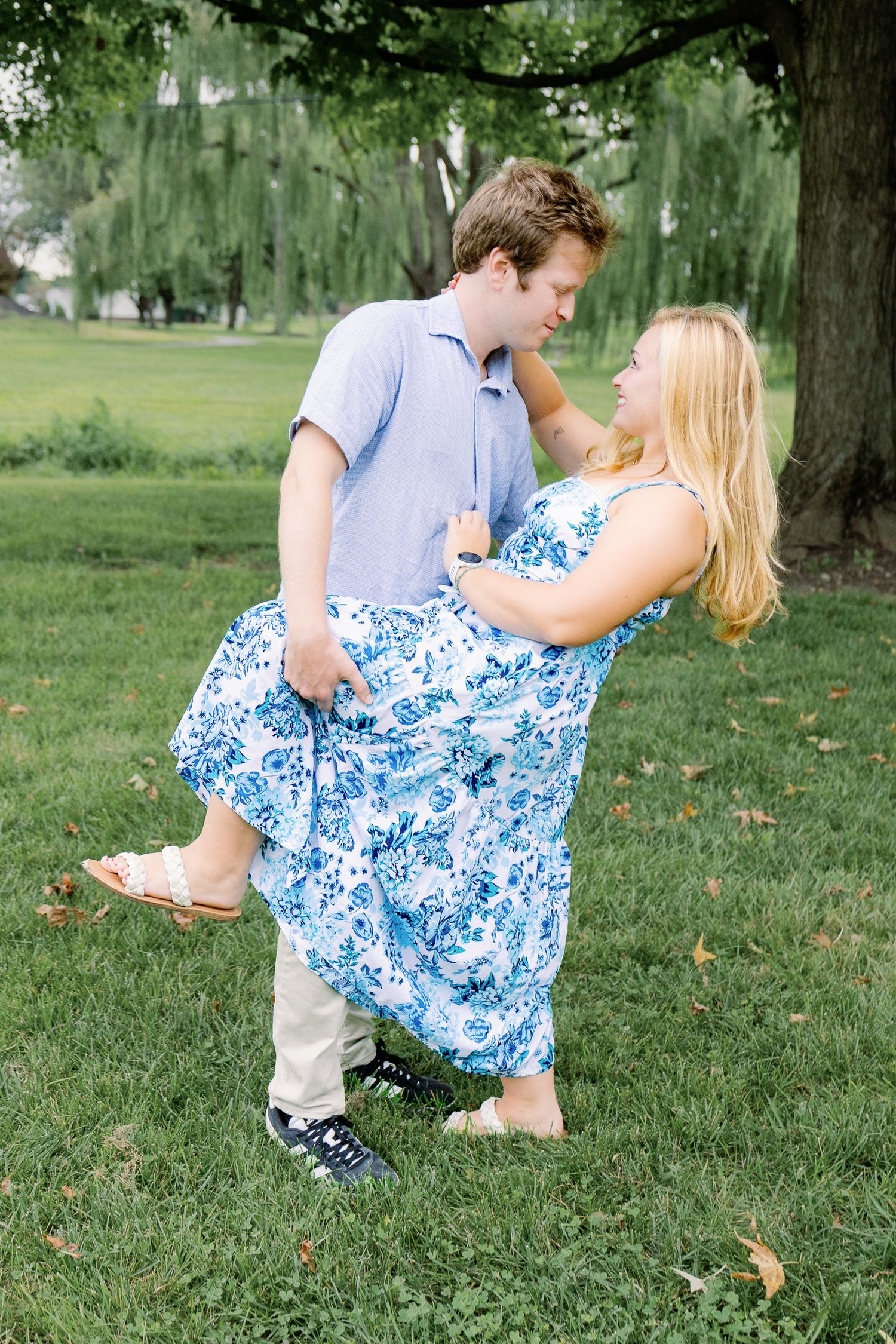 Couple sharing a playful dip on the lawn at Greenfield Park during a couples photography session in Lancaster, Pennsylvania.