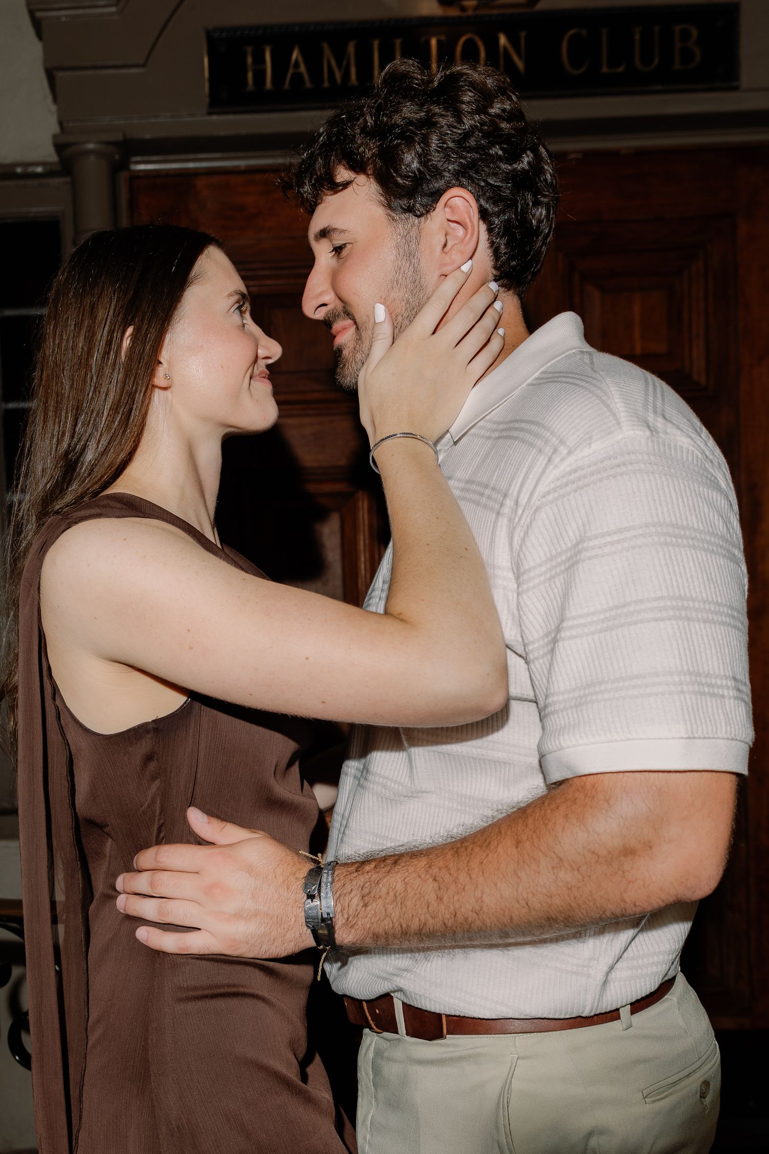 Engaged couple sharing an intimate moment during a downtown Lancaster, Pennsylvania engagement photography session