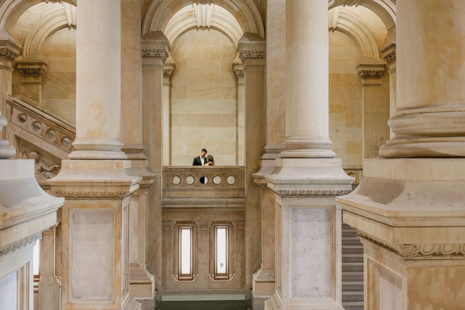 Ornate marble columns and grand staircase at Philadelphia City Hall, a popular setting for classic engagement portraits.