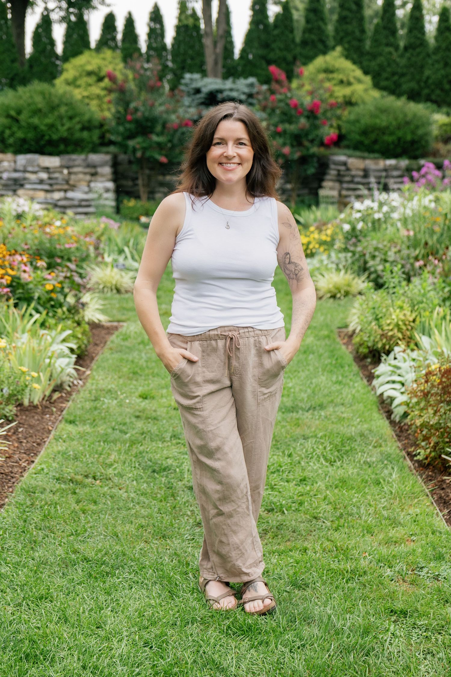 Woman standing in a garden during an outdoor lifestyle portrait photography session in Pennsylvania