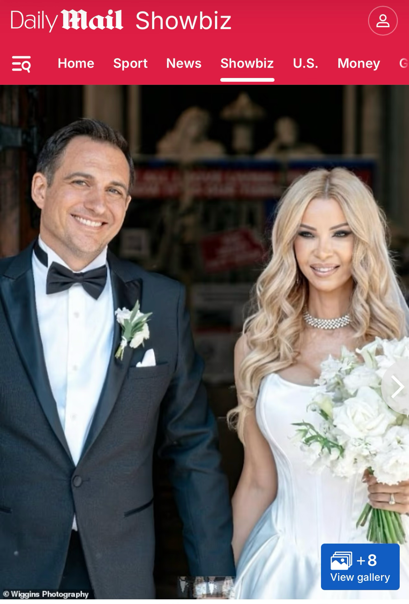 Elegant wedding couple posing, groom in tuxedo with boutonniere, bride in white gown holding bouquet, Daily Mail Showbiz.