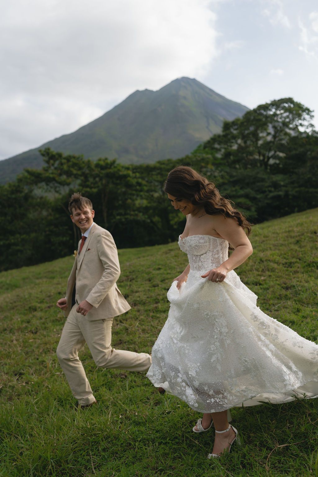 Couple exchanging vows during their Arenal Volcano elopement in La Fortuna