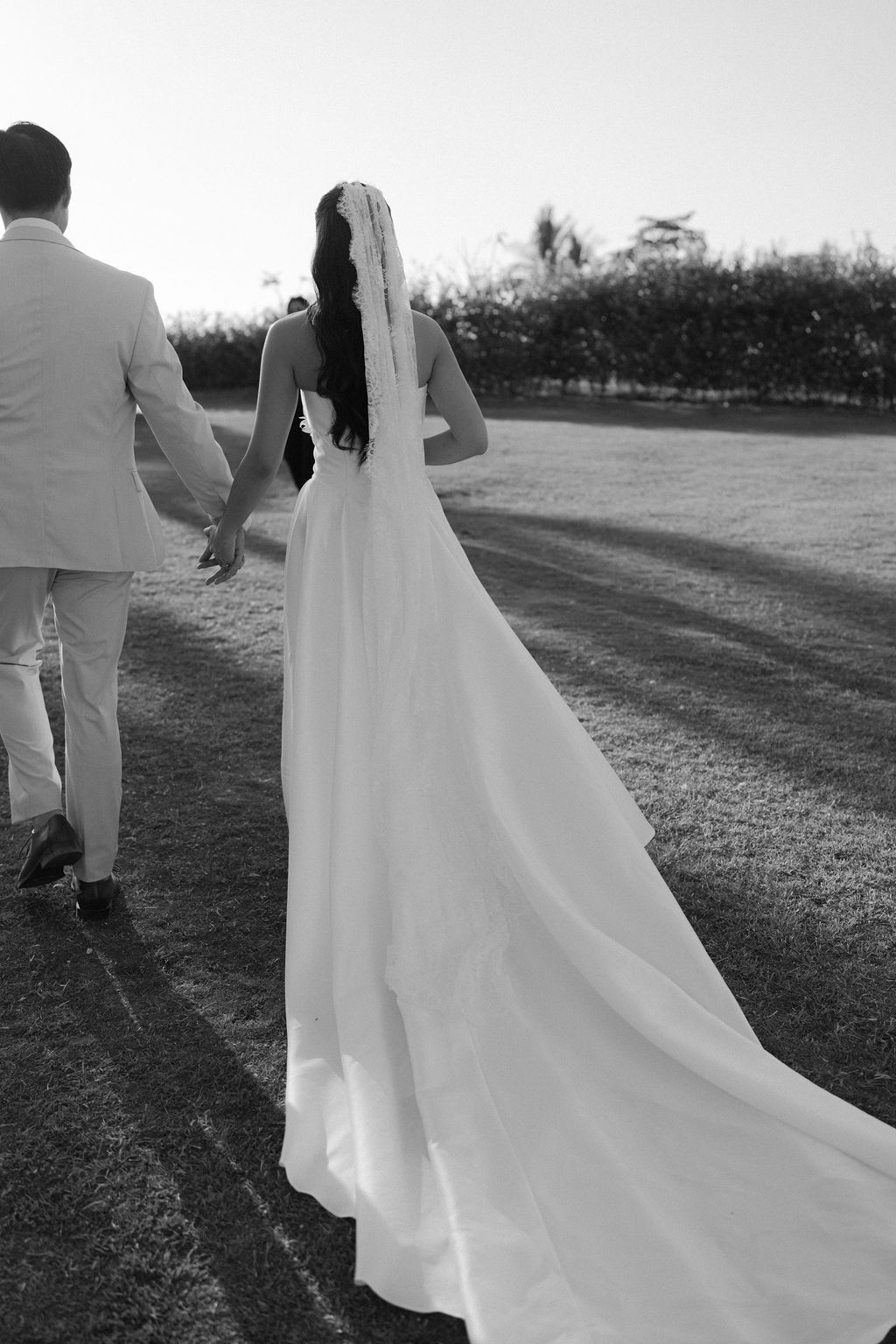 Bride and groom walking hand in hand after their wedding ceremony in Costa Rica.