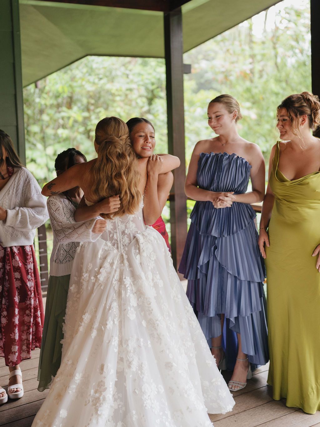 Bride embracing a bridesmaid during an emotional getting-ready moment in Costa Rica