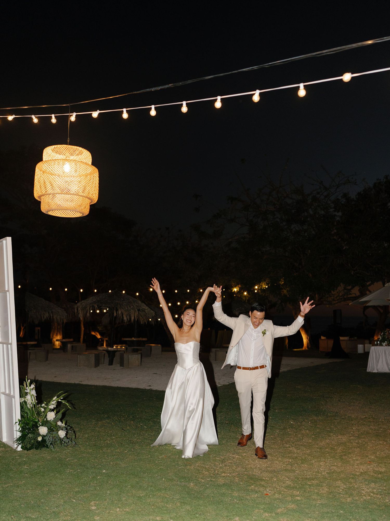Ashley and Ryan entering their outdoor wedding reception at Hacienda Pinilla