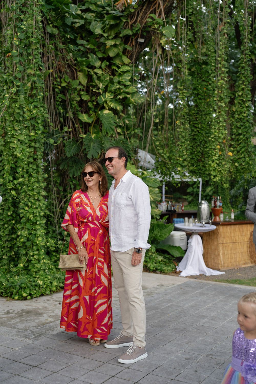 Wedding guests sharing a candid moment during an outdoor celebration